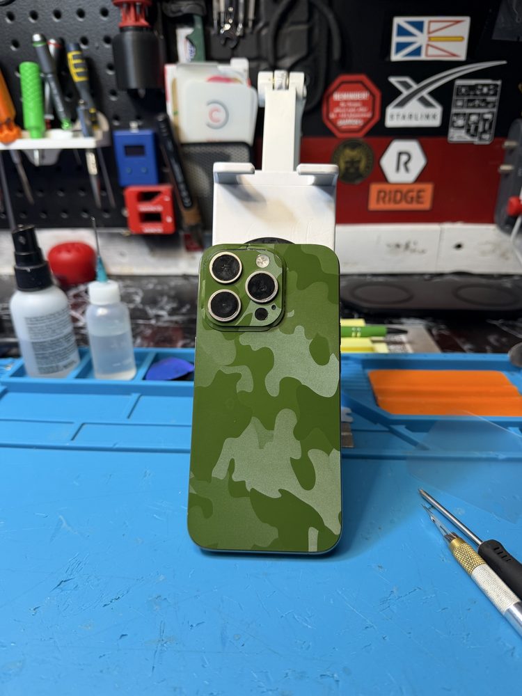 iPhone with a green camouflage skin applied