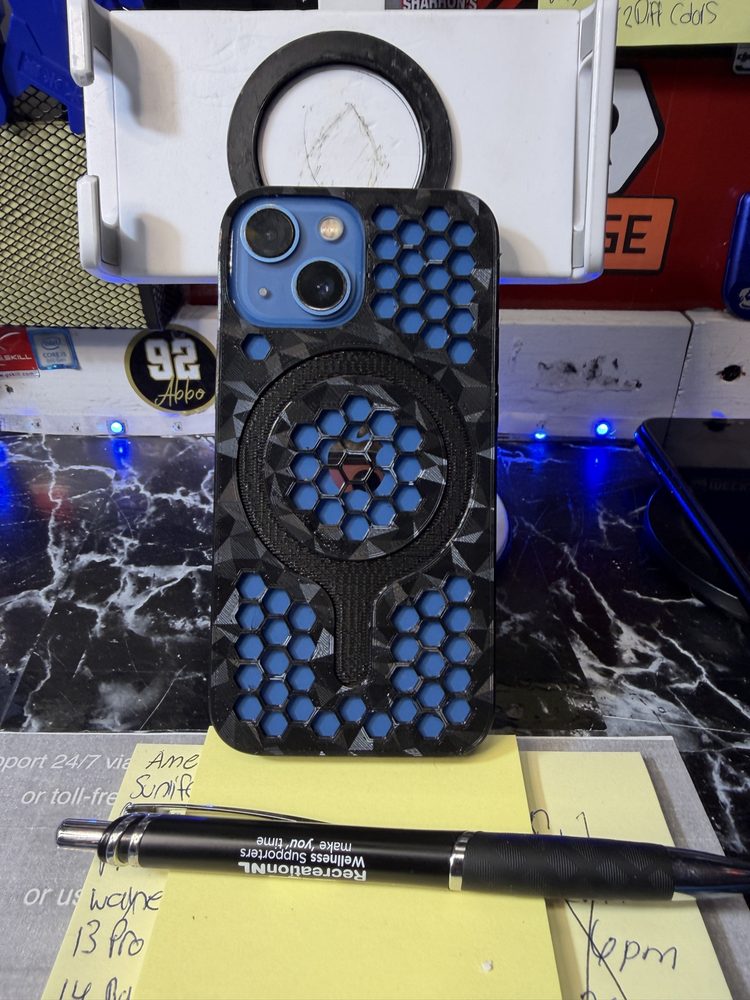 iPhone in a black and blue honeycomb MagSafe case