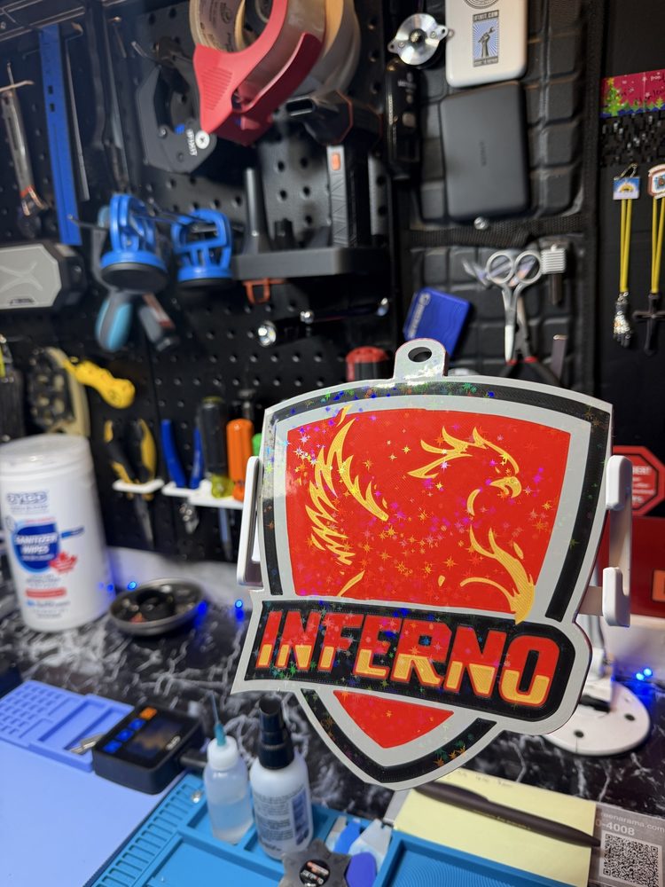 Red and gold phoenix shield badge reading Inferno