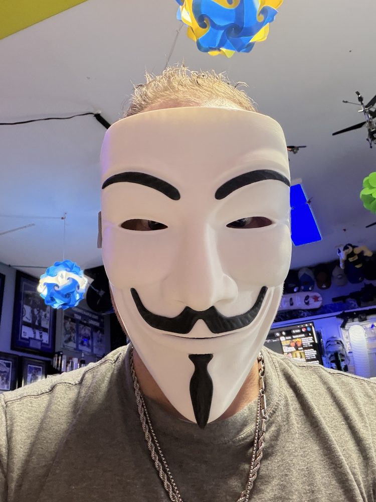 3D-printed V for Vendetta style mask worn in the shop