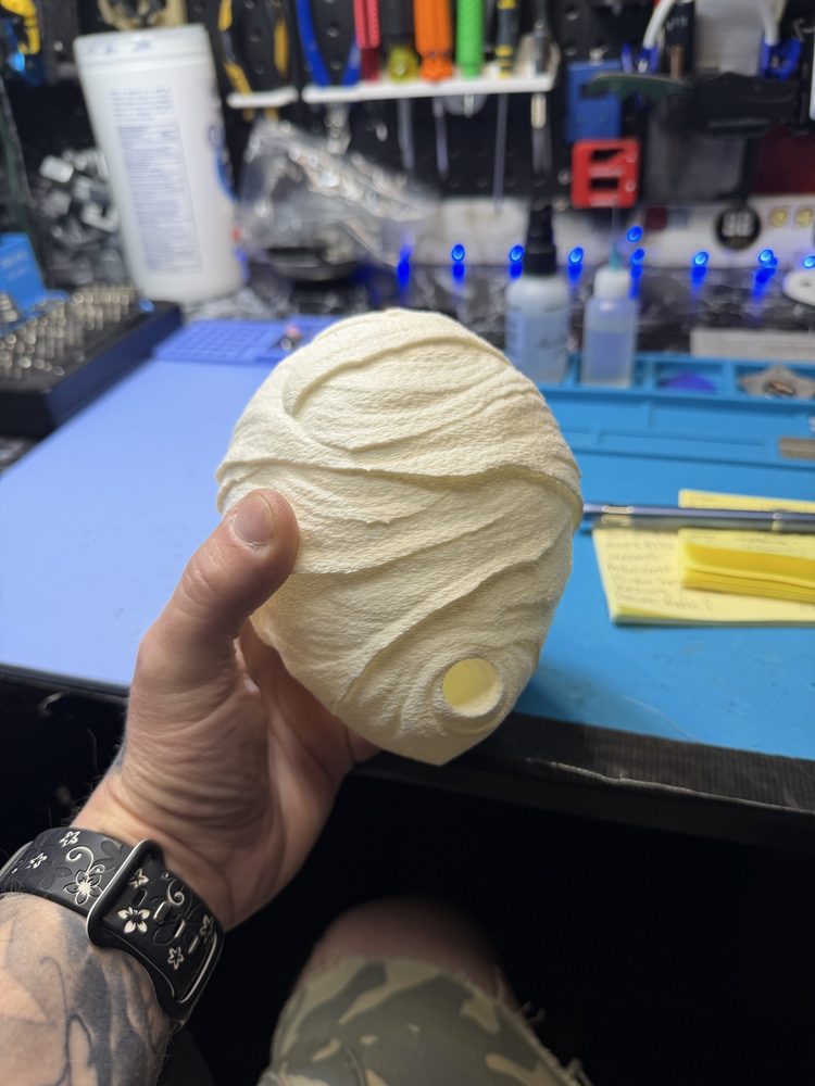 3D-printed wasp nest held in a hand